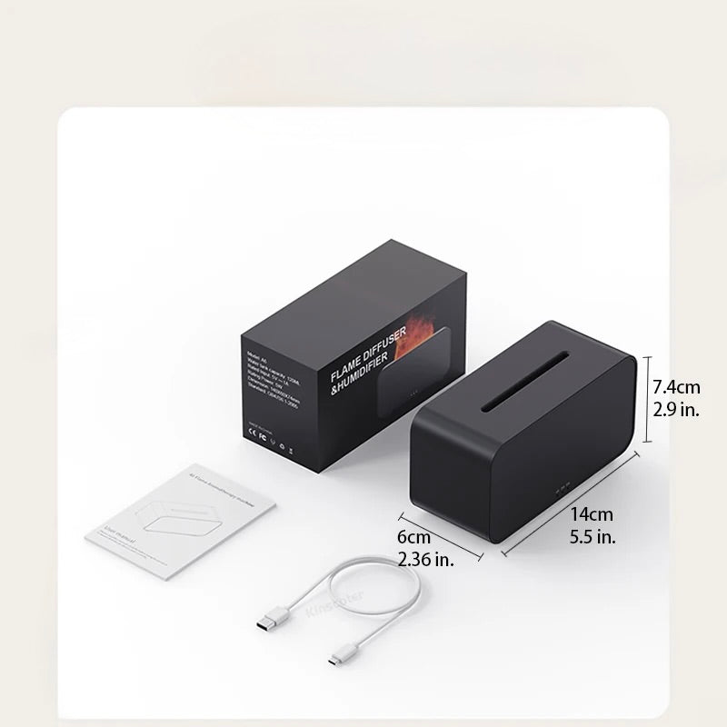 Black electronic aromatherapy humidifier with packaging, cable, and user manual on a light beige background