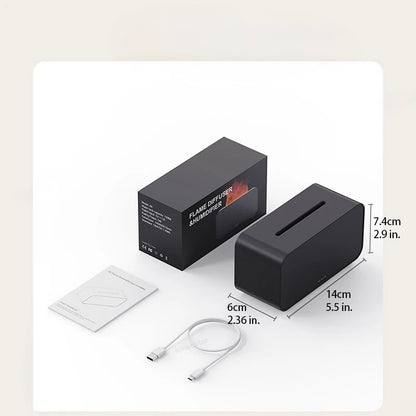 Black electronic aromatherapy humidifier with packaging, cable, and user manual on a light beige background
