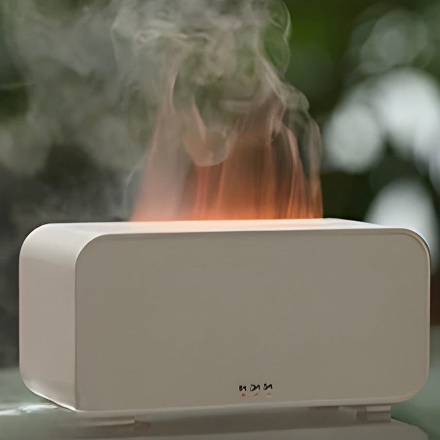 White LED-flame humidifier emitting steam with a blurred green background